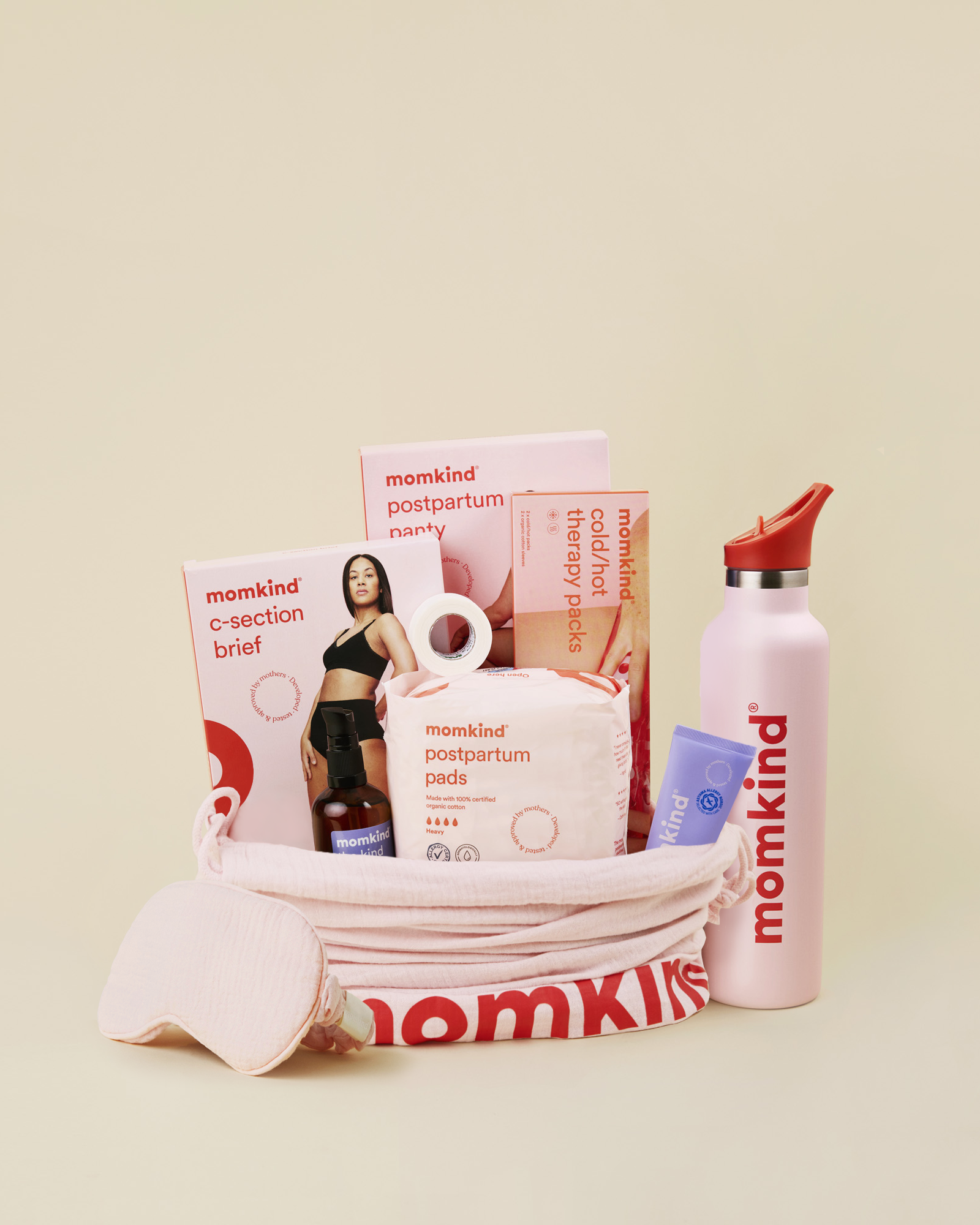 Momkind luksus efterfoedselspakke til kejsersnit. Efterfoedselsbind, lanolin balm, kejsersnittrusser, efterfoedselstrusser, sovemaske, termodunk, varme/koele pose.