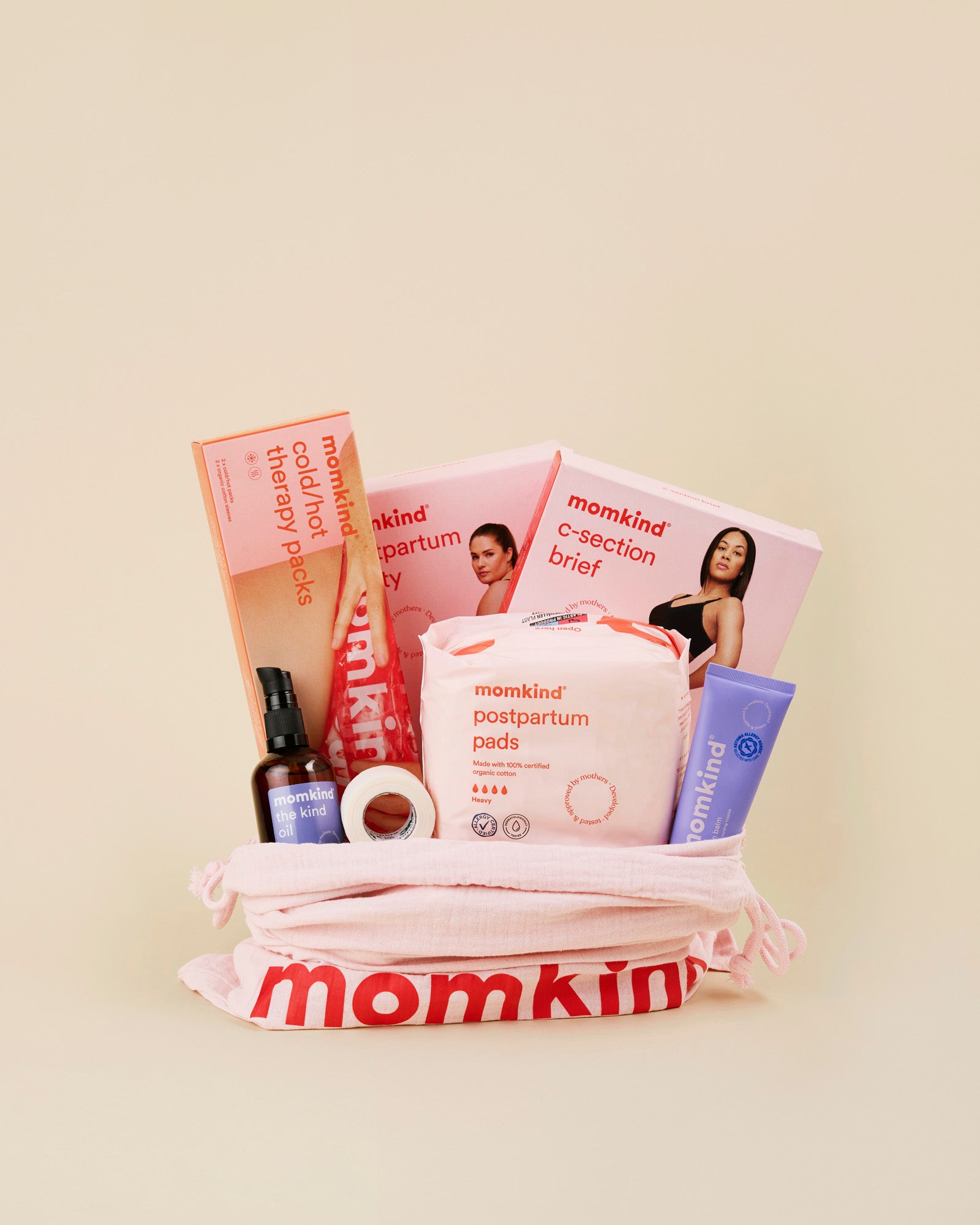 Stor efterfoedselspakke fra momkind til kejsersnit. Posen indeholder efterfoedselsbind, englehud plaster, lanolin balm, kind oil, koele/varme pose, kejsersnittrusser og efterfoedselstrusser. 